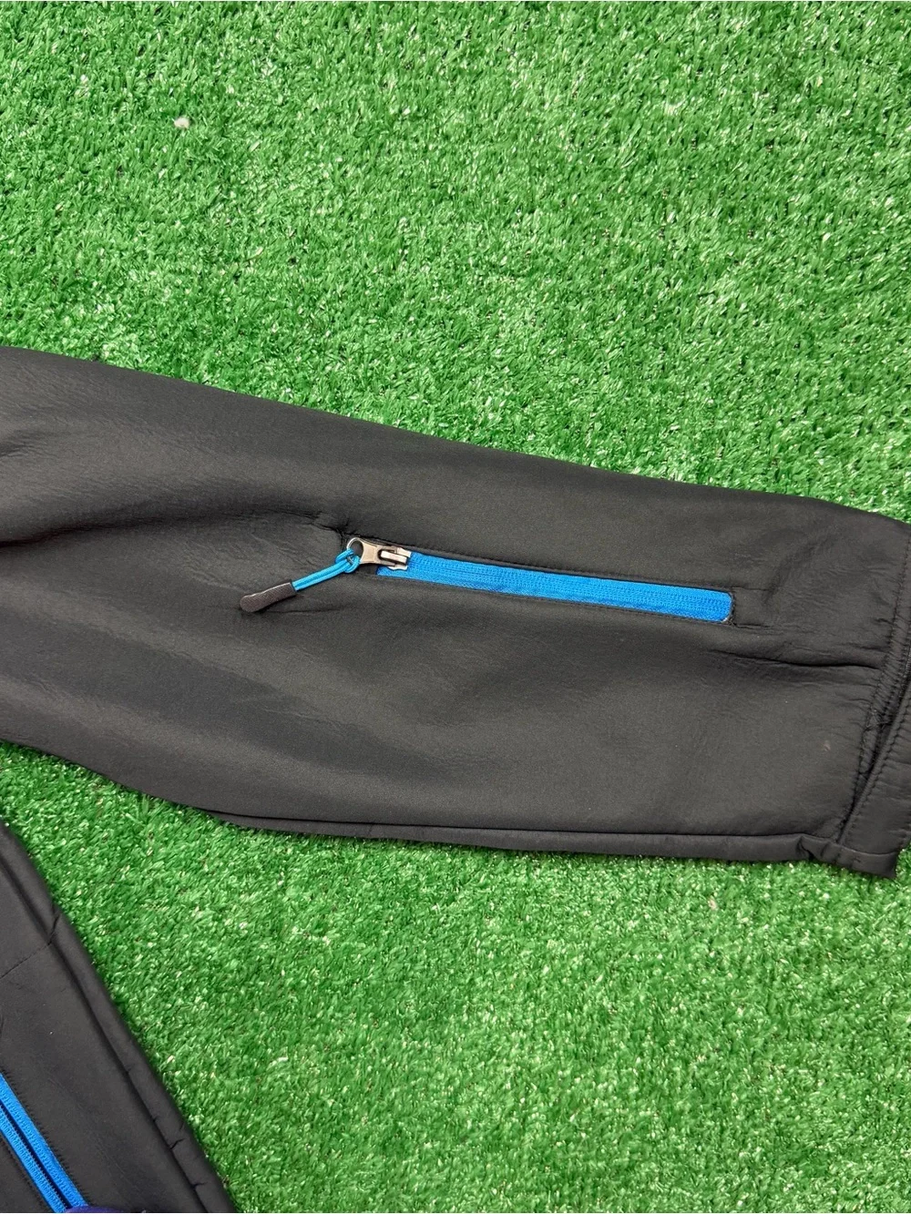 The North Face Black Jacket with Blue Zipper Accents